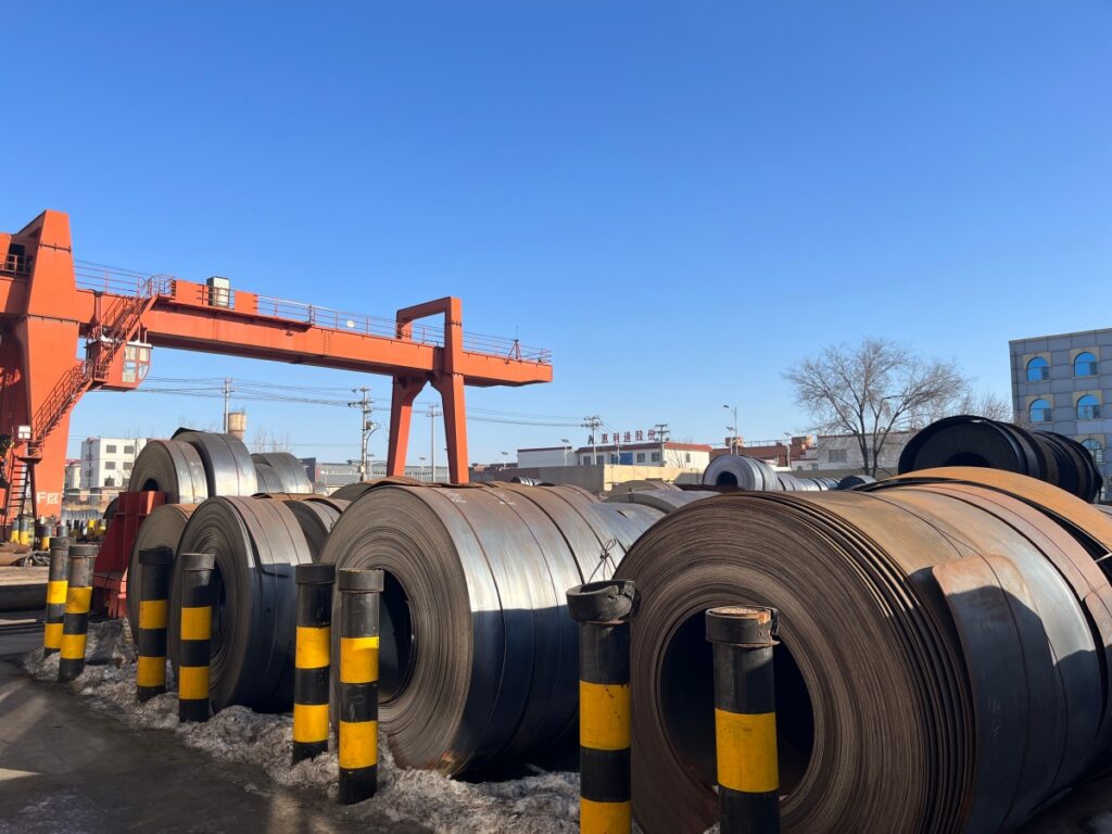 Steel coil feedstock in an industrial facility