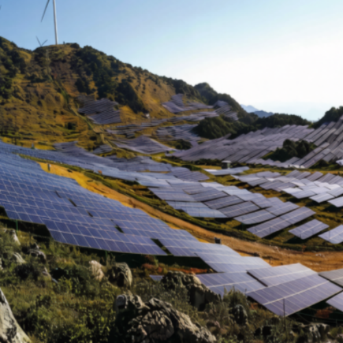 PV arrays installed across hilly terrain